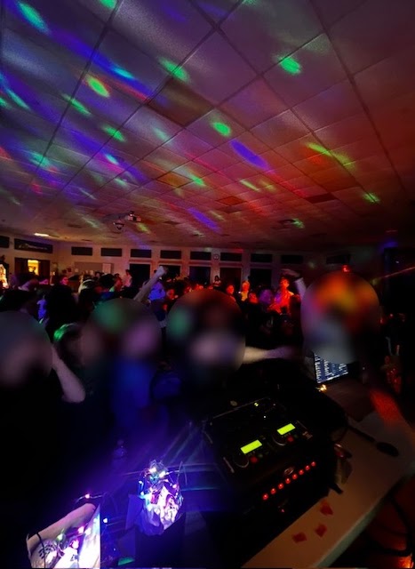 A school event with a hopping dance floor.